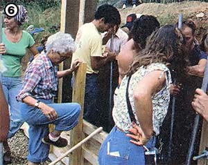 
[6] A rammed earth structure can be built quickly and easily when this many people are willing to get their hands dirty!  
